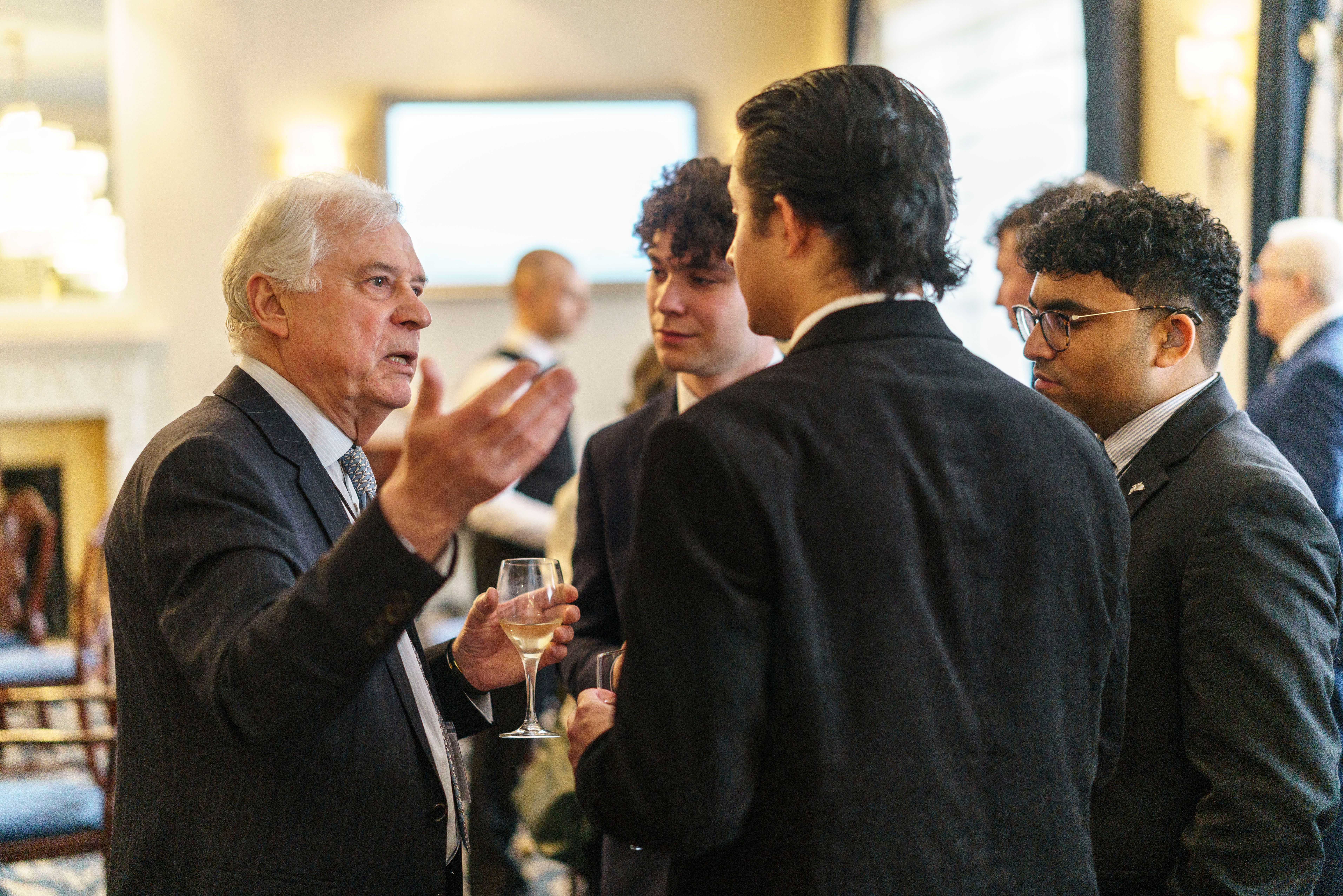 Picture depicting students speaking with a member